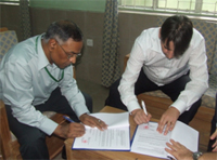 Mr. Shafiq-ul Islam and Mr. Christoph Vogt signing the MoU